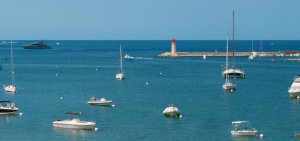 View from a roof terrace of a penthouse in Port Andratx. View over a lighthouse, yacht and boat anchorage, harbour and marina La Vela